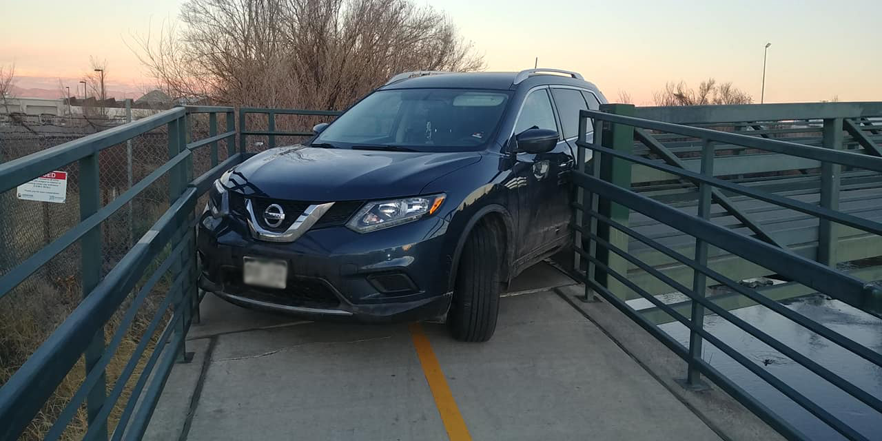 Car stuck on S Platte River Trail
