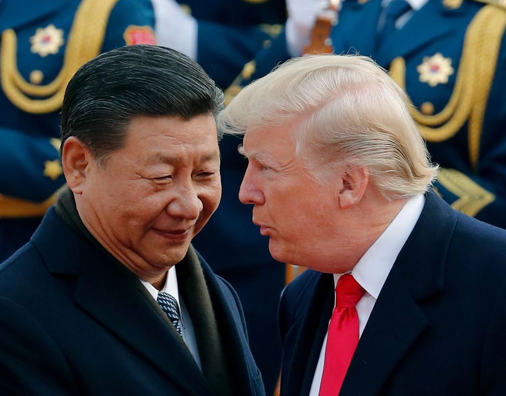 In this Nov. 9, 2017, file photo, U.S. President Donald Trump, right, chats with Chinese President Xi Jinping.