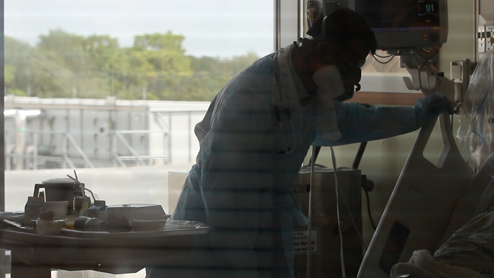 Dr. Salman Ahmed treating a COVID-19 patient, AdventHealth Tampa. 