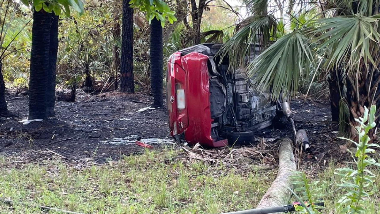 A red sedan flipped over on the side of Interstate 95 in Martin County following a hit-and-run crash on Feb. 23, 2023.jpg