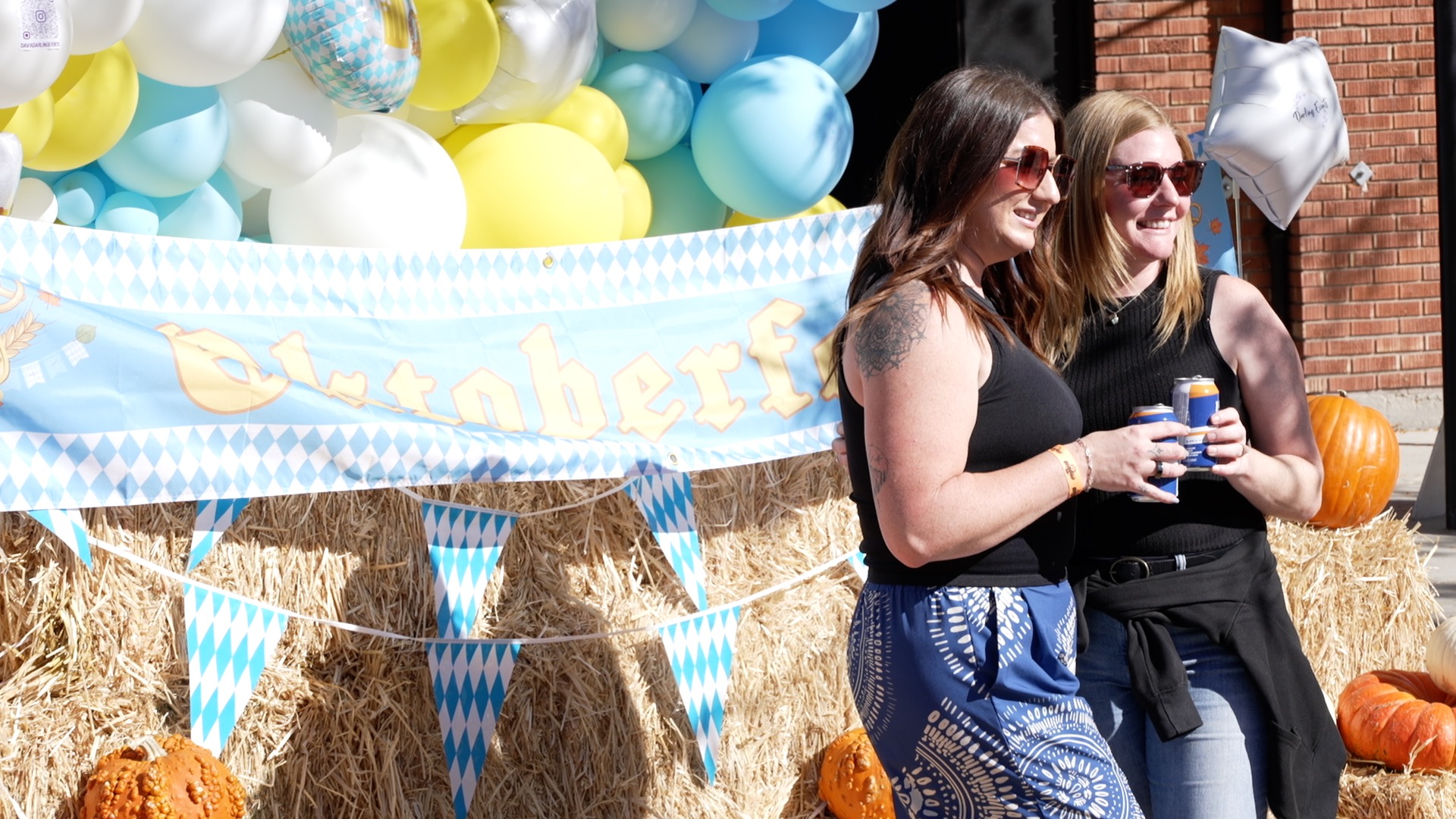 locals post at oktoberfest sign.jpg