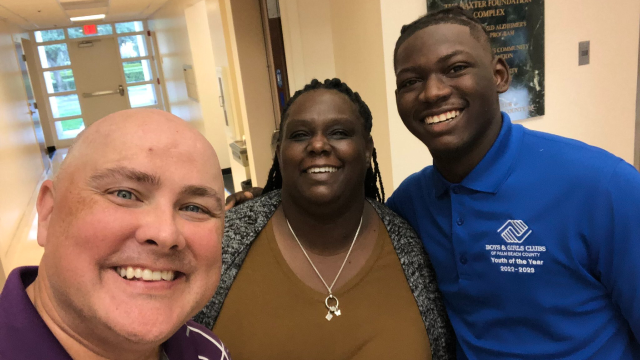 WPTV journalist T.A. Walker with officials from the Boys & Girls Clubs of Palm Beach County, Dec. 15, 2022.jpg