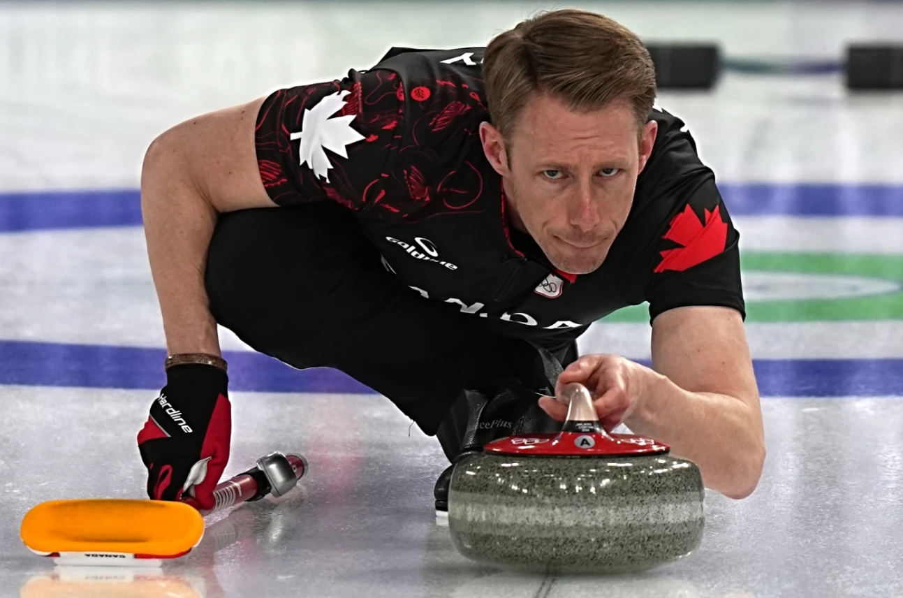 Canada's Marc Kennedy in action during the men's curling round robin session against the United States, at the 2026 Winter Olympics, in Cortina d'Ampezzo, Italy, Friday, Feb. 13, 2026.
