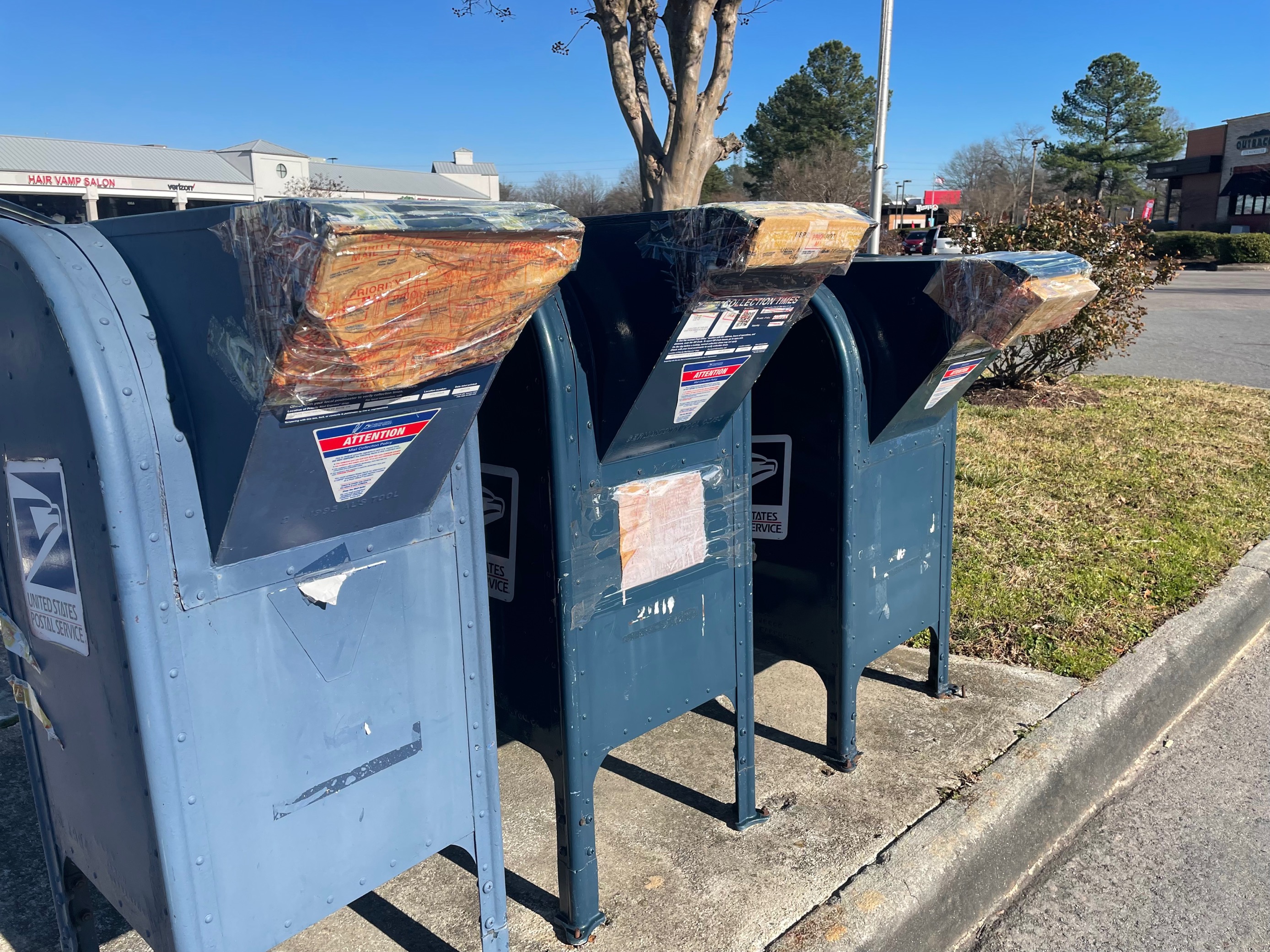 USPS collection bins taped across Hampton Roads