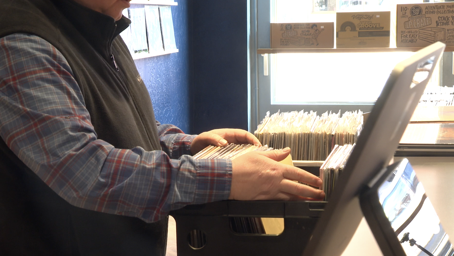 Derek Anderson sorts vinyl records at his new store Modern Sounds in Twin Falls on Friday, March 14, 2025