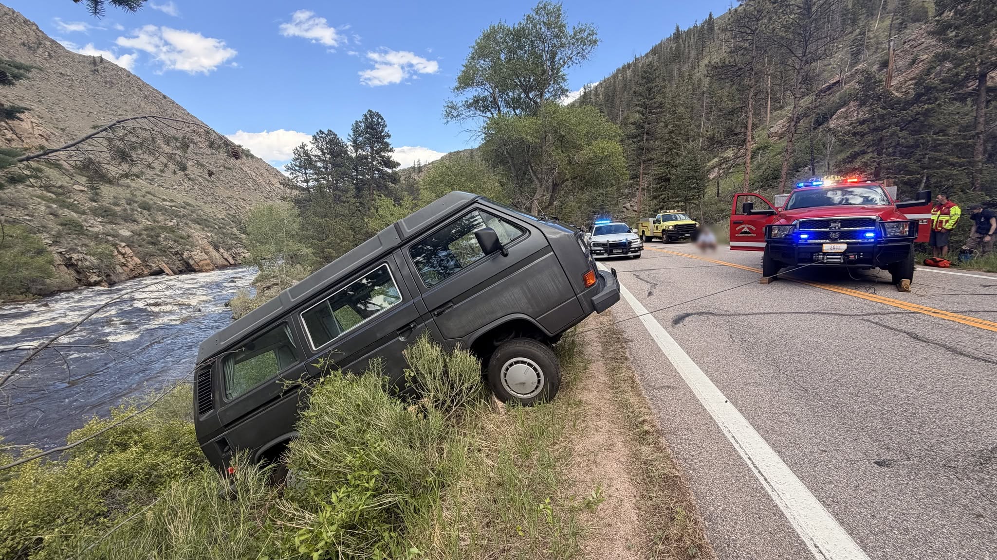 Driver rescued after van backs up a little too far into Poud