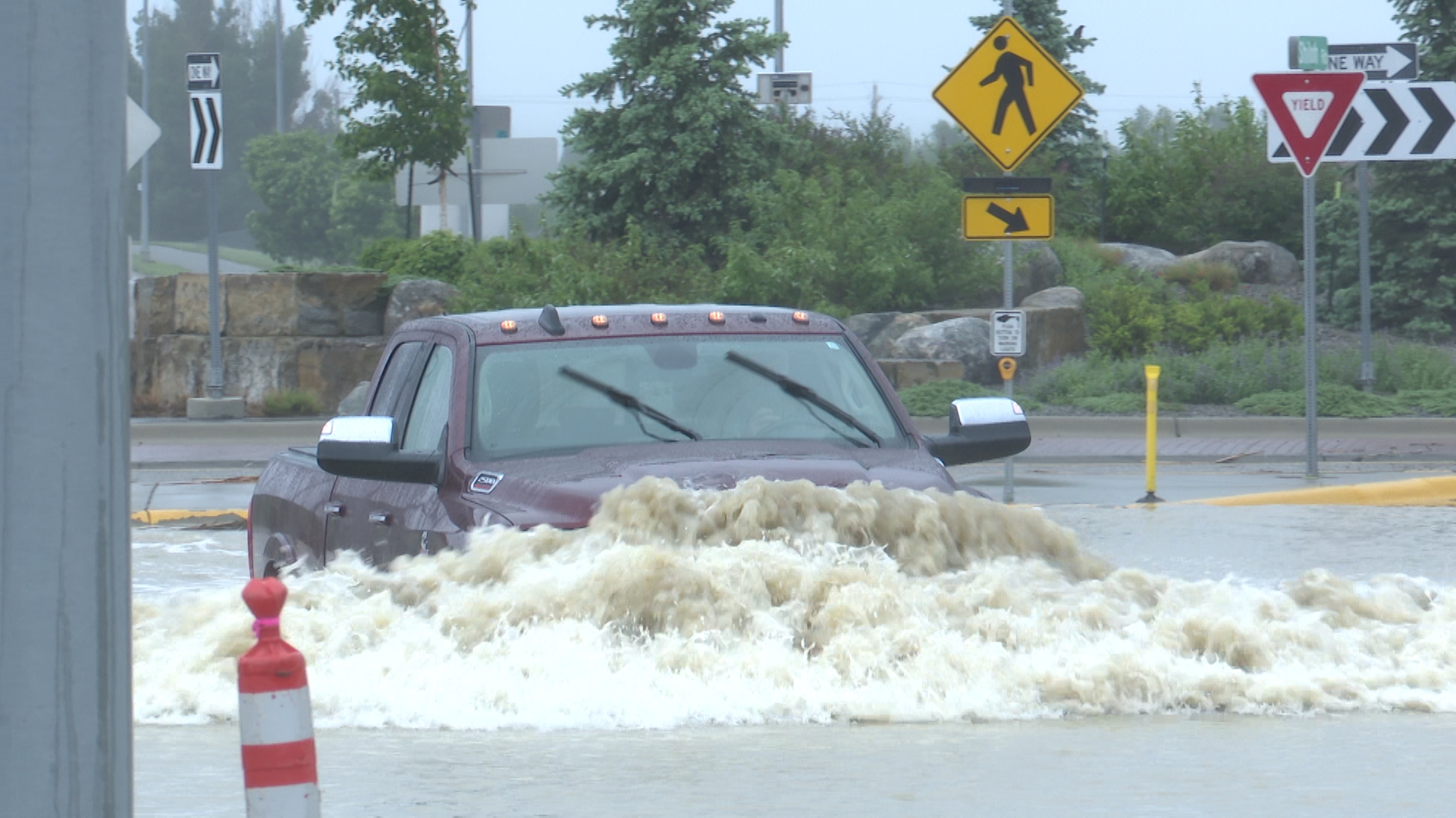 Pickup attempts to drive through flooded S. Shiloh Road