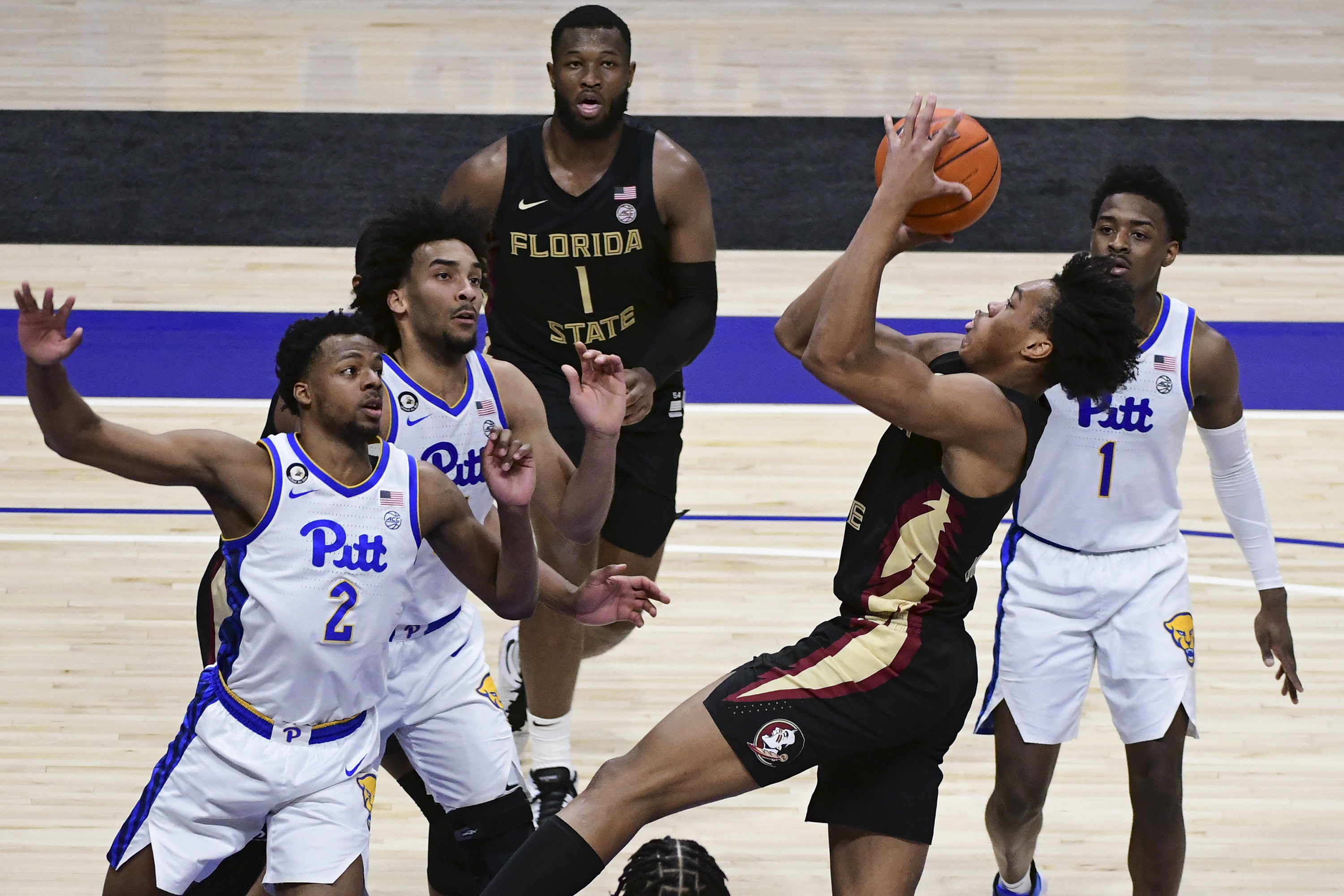 Florida State Seminoles guard Scottie Barnes shoots over Pittsburgh Panthers guard Femi Odukale, Feb. 20, 2021