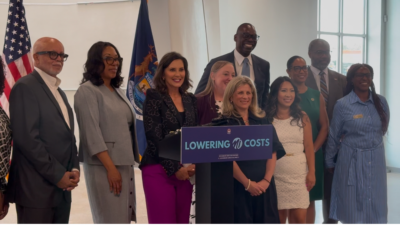 Michigan Gov. Gretchen Whitmer is pictured with others as the state erases $144 million in medical debt for more than 210,000 residents through a nonprofit partnership.