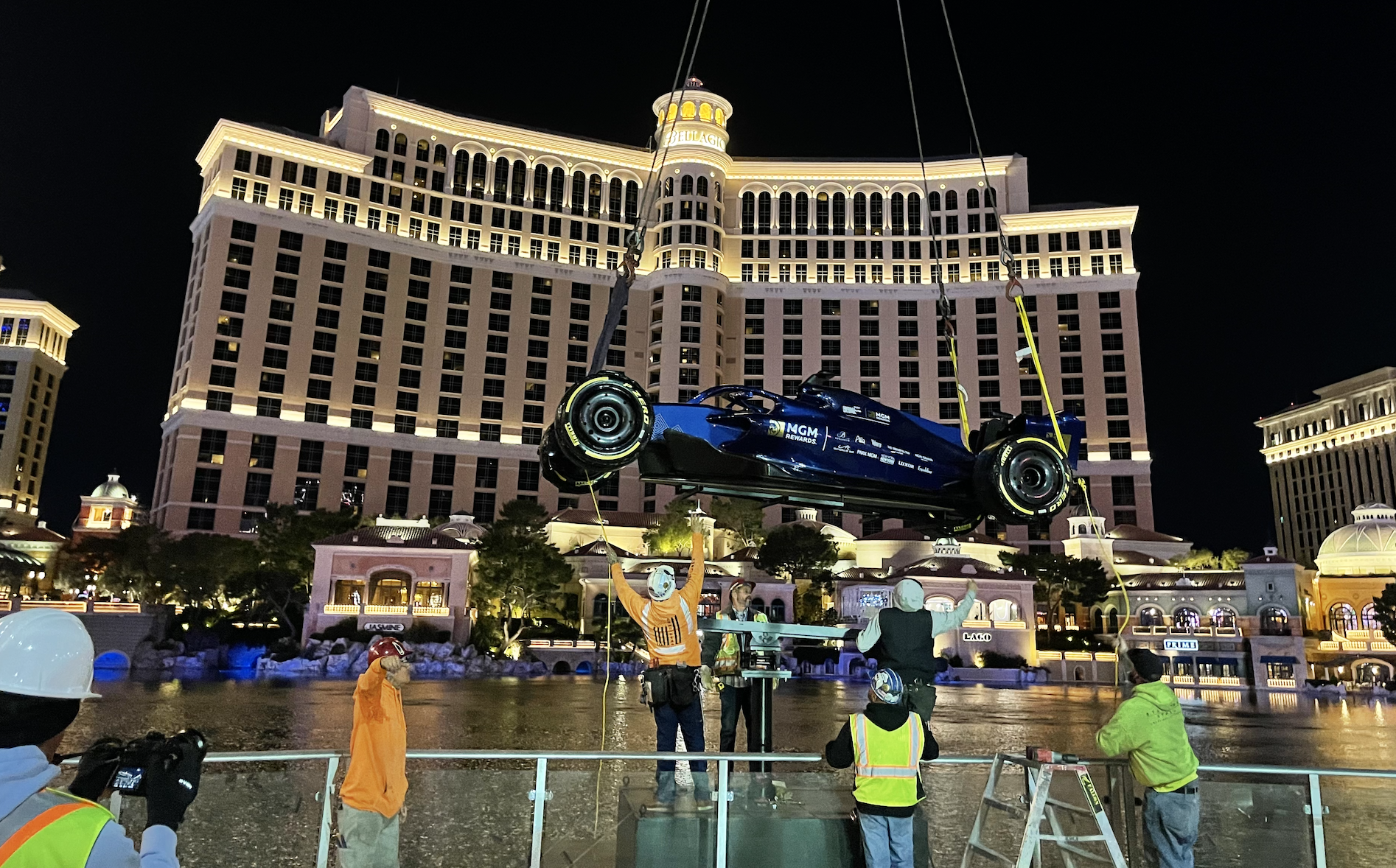 Crews install MGM Rewards' F1 show car at Bellagio Fountains