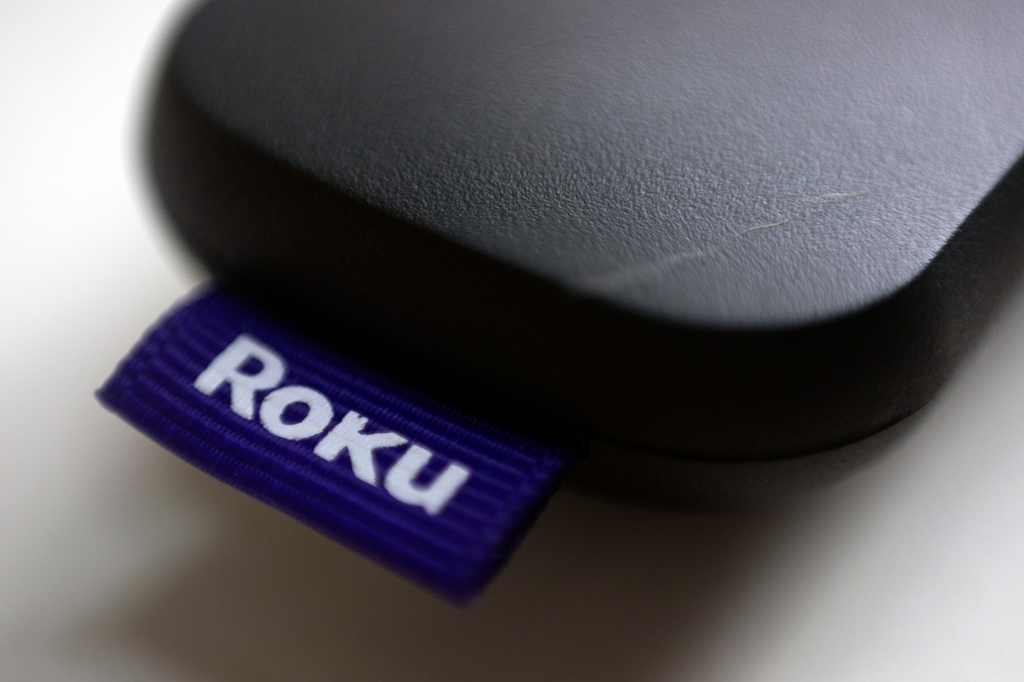 Photo shows a logo for Roku on a remote control in Portland, Ore. 