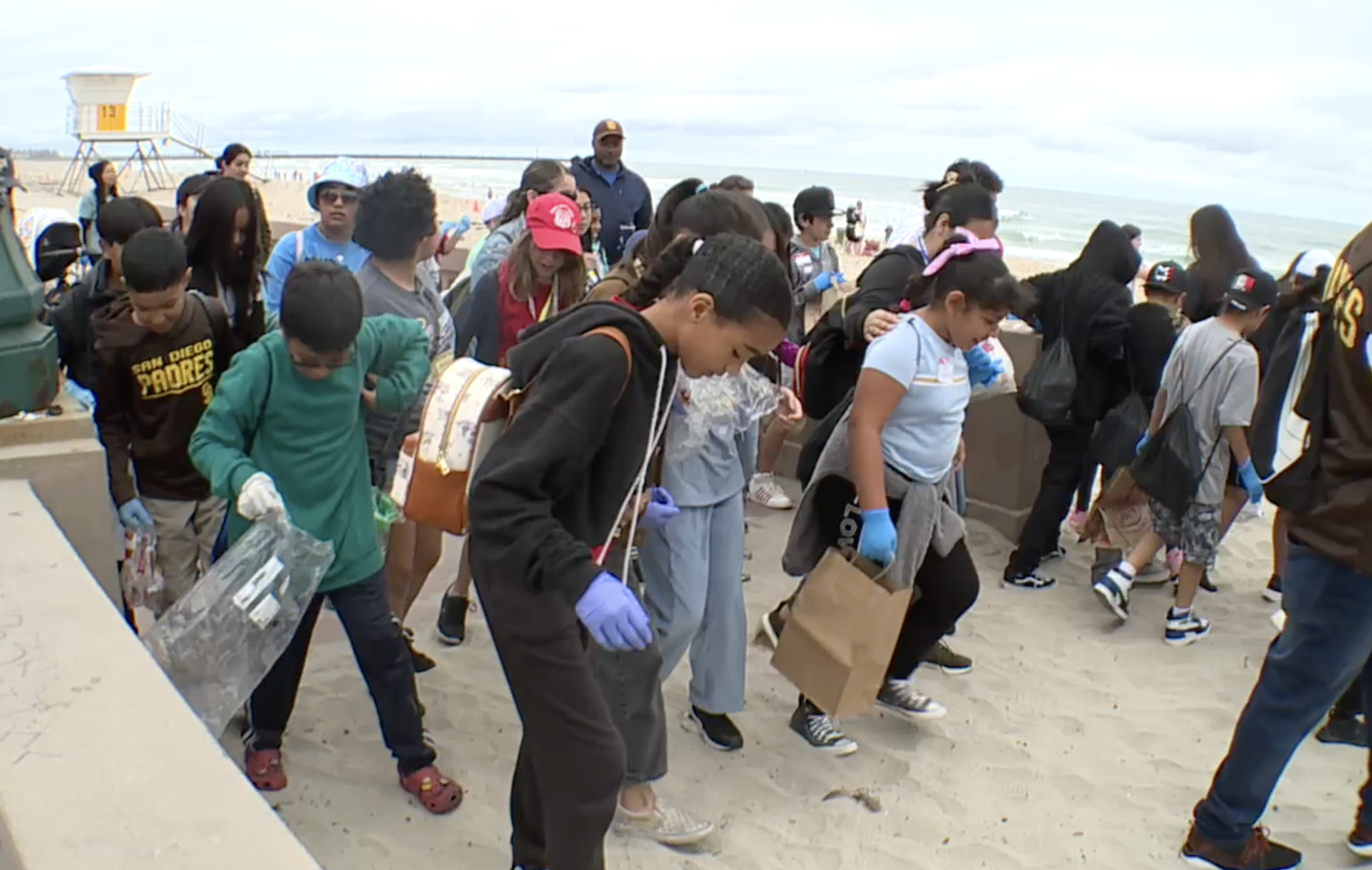 Hundreds of students participate in beach clean up for Kids Ocean Day