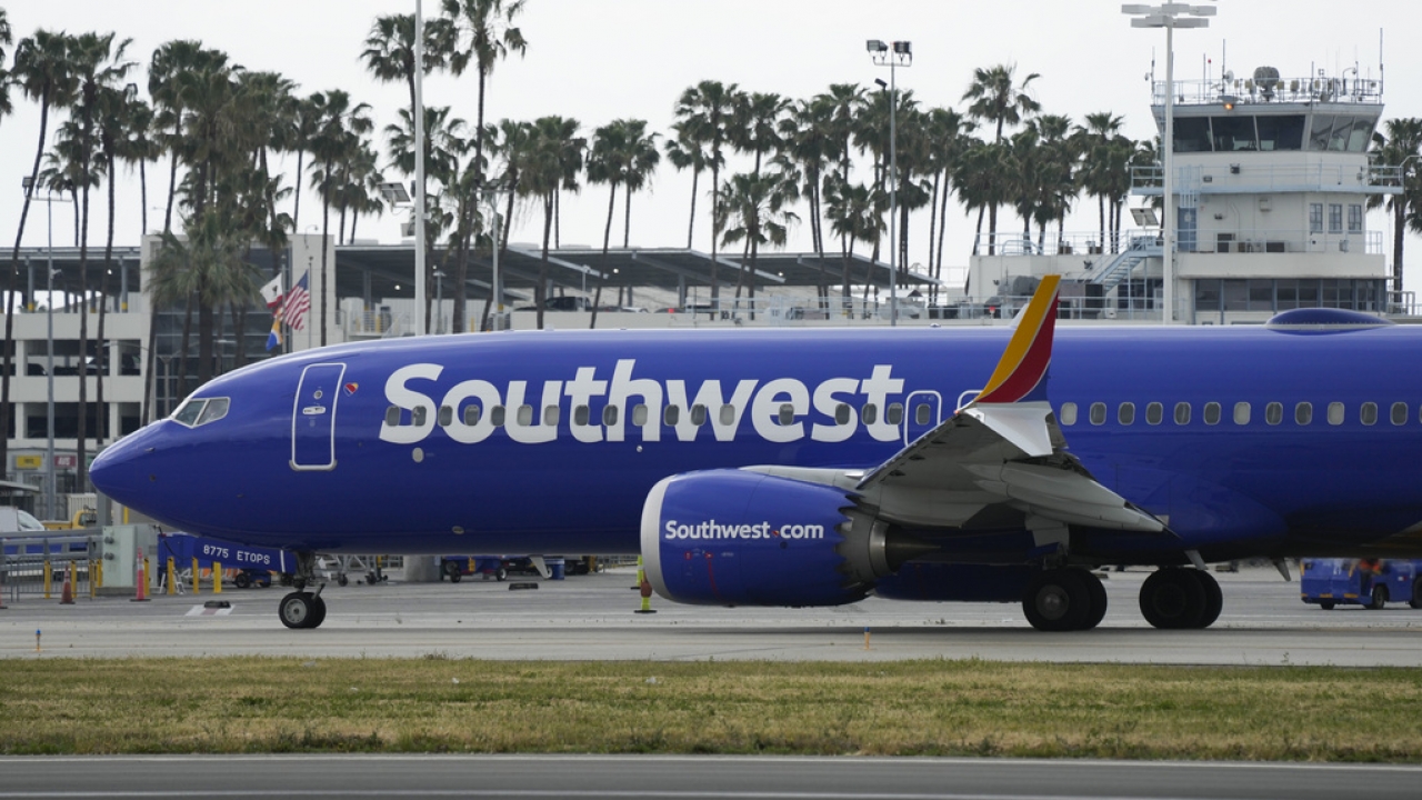 A Southwest Airlines plane taxis on the runway.