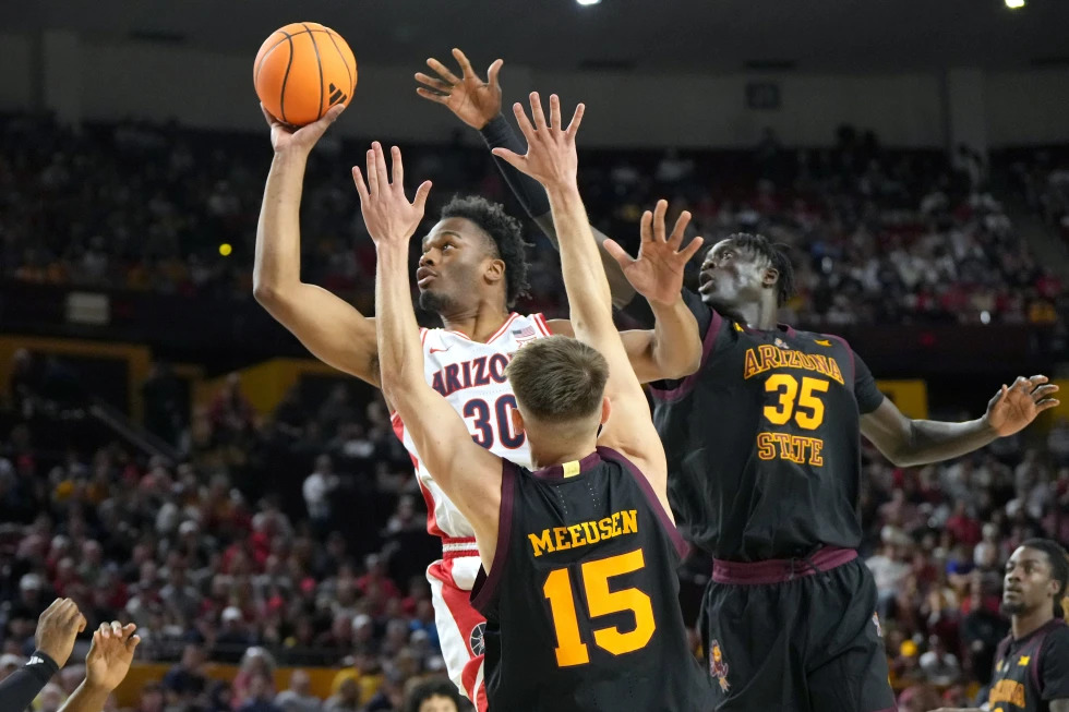 No. 1 Arizona sets school record with 22nd straight win to start season, beating Arizona State 87-74