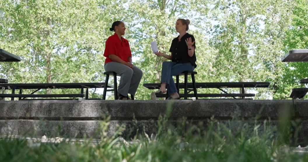 Omaha Performing Arts Marketing Director Dara Hogan, left, talks with 3 News Now's Mary Nelson at Miller Park.