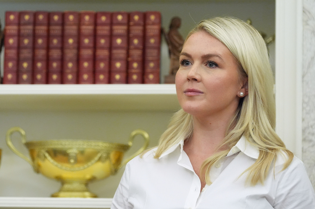 White House press secretary Karoline Leavitt listens as President Donald Trump speaks in the Oval Office of the White House, Thursday, Aug. 6, 2026, in Washington. 