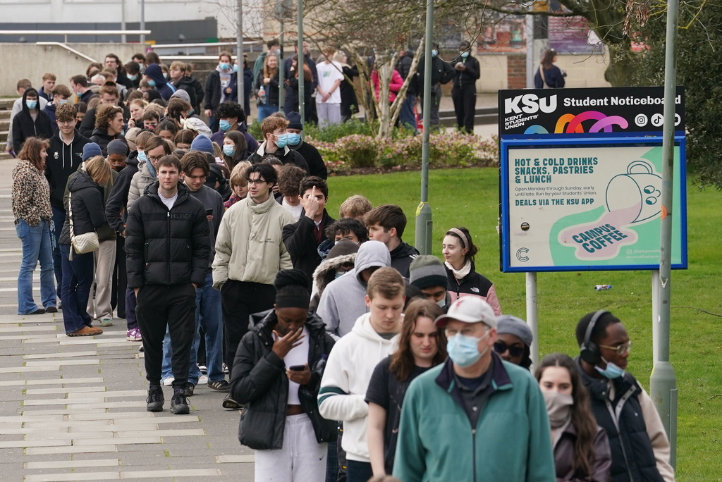 Students queue for antibiotics outside a building at the University of Kent, following an outbreak of meningitis, in Canterbury, Kent, England, Monday March 16, 2026. 