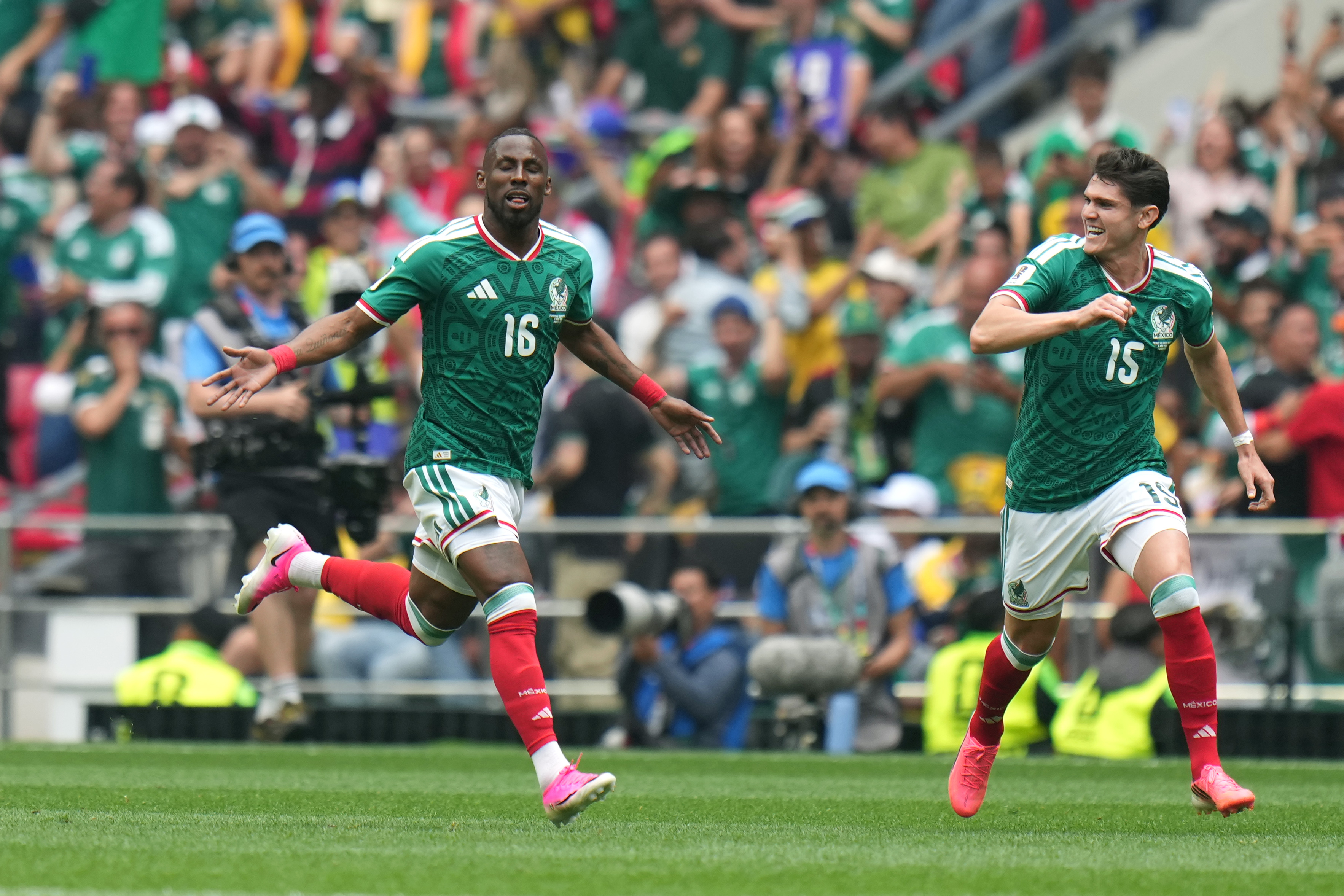 Mexico's Julian Quinones (16) celebrates with Israel Reyes after scoring their opening goal against South Africa during the World Cup Group A soccer match between Mexico and South Africa in Mexico City, Thursday, June 11, 2026. 
