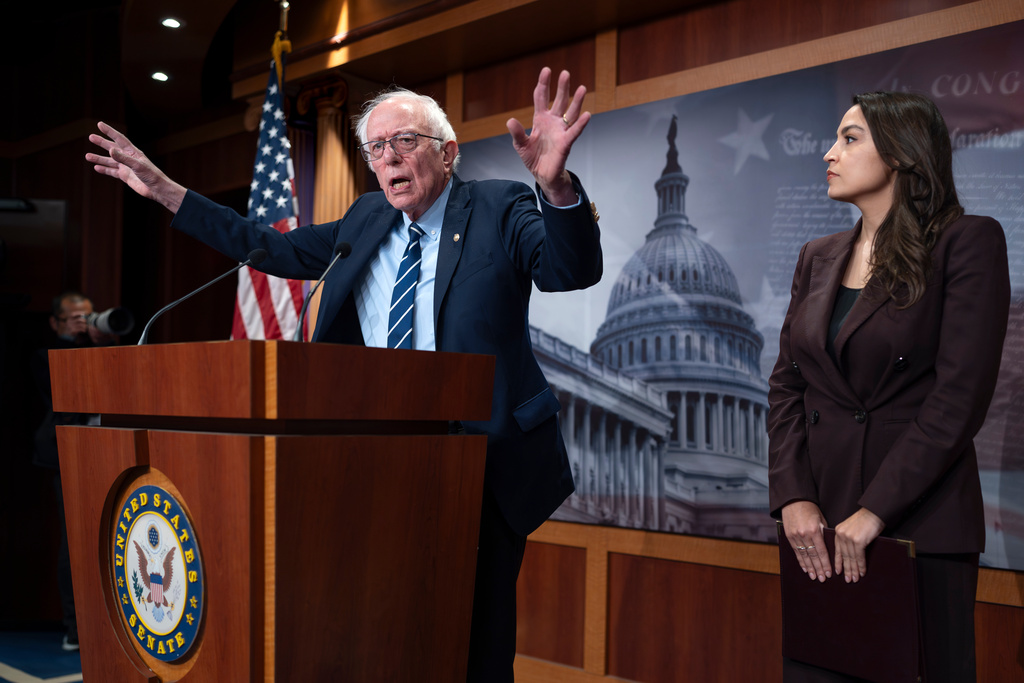 Sen. Bernie Sanders, I-Vt., left, and Rep. Alexandria Ocasio Cortez, D-N.Y., hold a news conference on the Artificial Intelligence Data Center Moratorium Act, at the Capitol in Washington, Wednesday, March 25, 2026. 