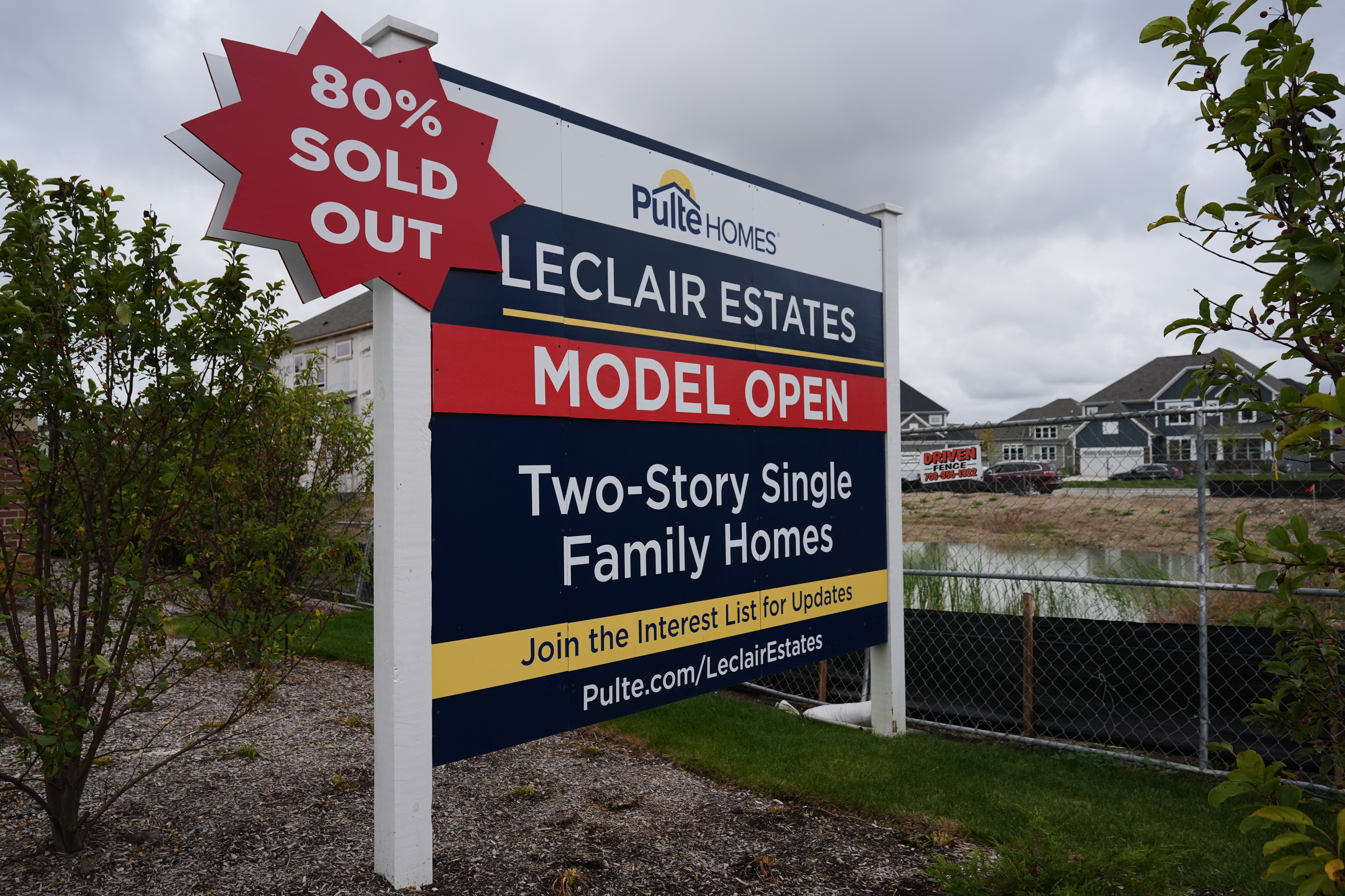 A sign stands in front of a new home construction site in Deerfield, Ill., Wednesday, Oct. 14, 2026.