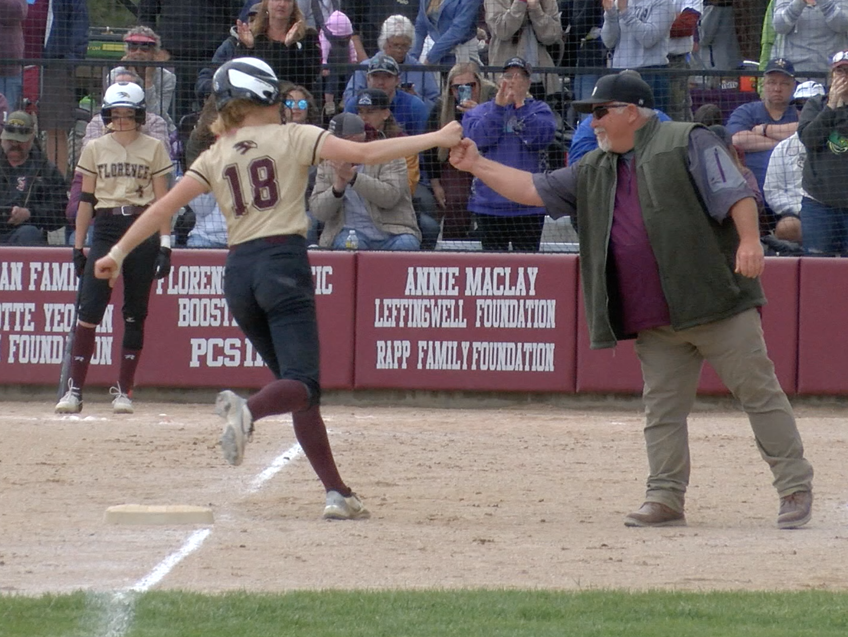 Florence's Kasidy Yeomon celebrates with head coach Maurice Craun