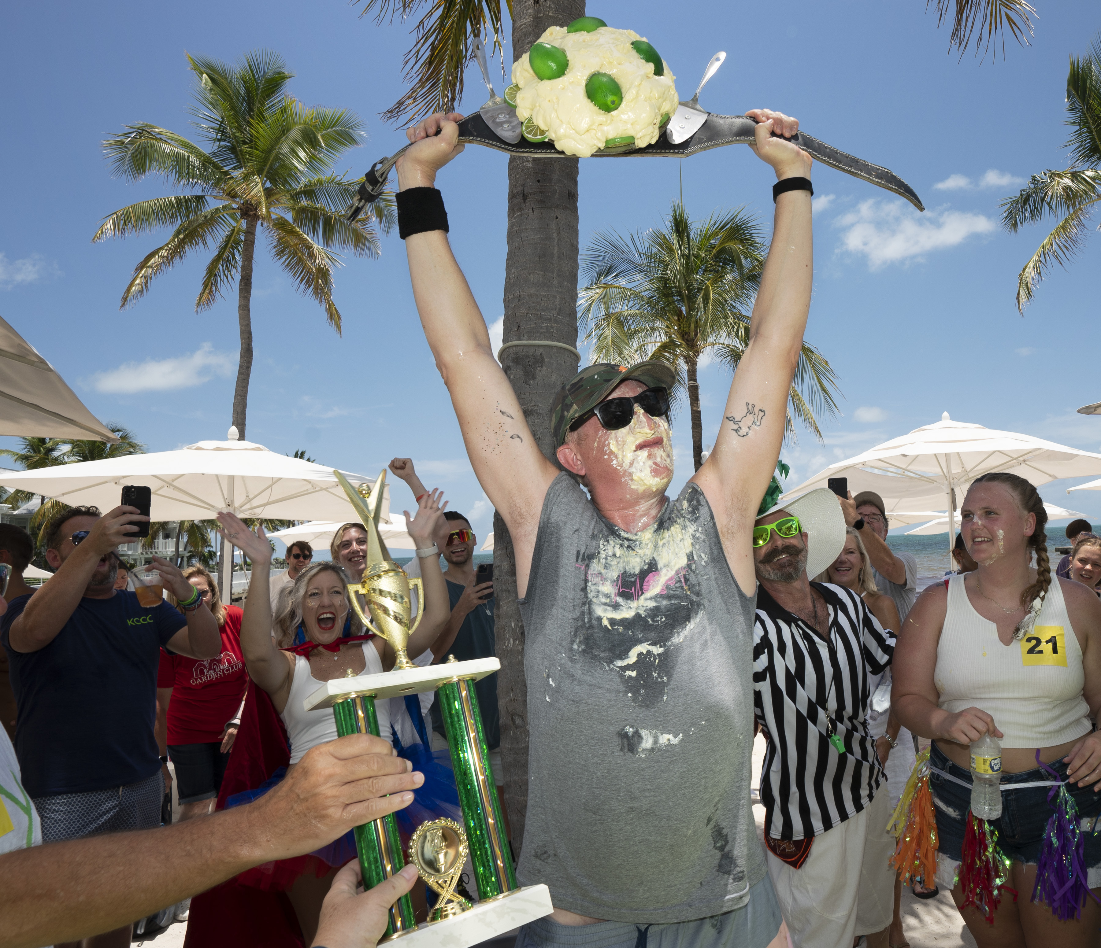 Chris Shultz holds victory belt after winning Key Lime Pie Eating Championship in Key West, July 4, 2022