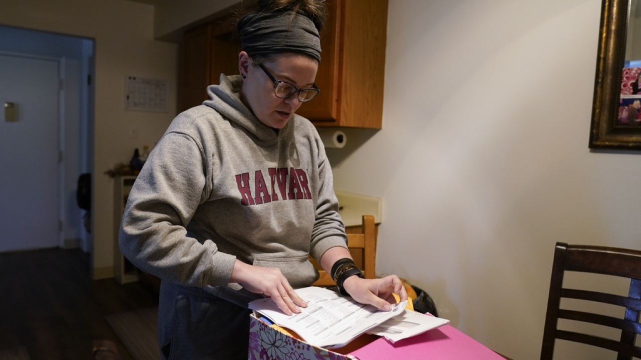 Samantha Richards looks over her Medicaid papers