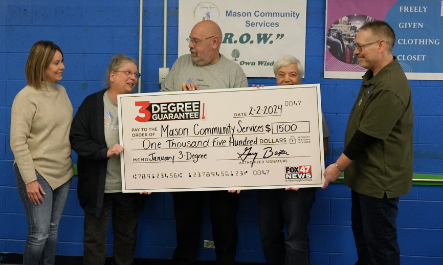 Fox 47 and Hager Fox present the 3 Degree Guarantee check to Mason Community Services