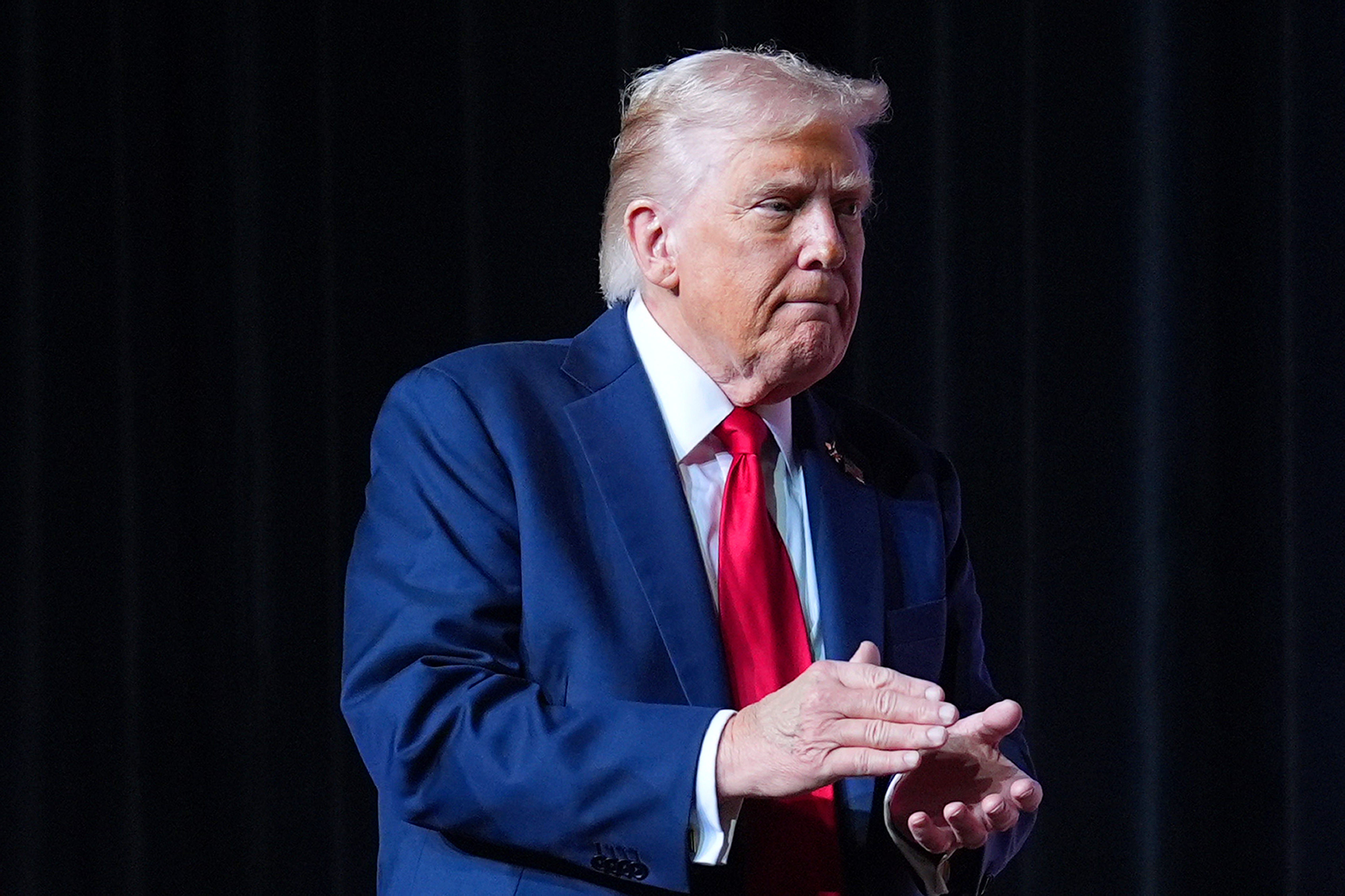 President Donald Trump walking off stage after speaking to a gathering of top U.S. military commanders at Marine Corps Base Quantico, Tuesday, Sept. 30, 2025, in Quantico, Va.