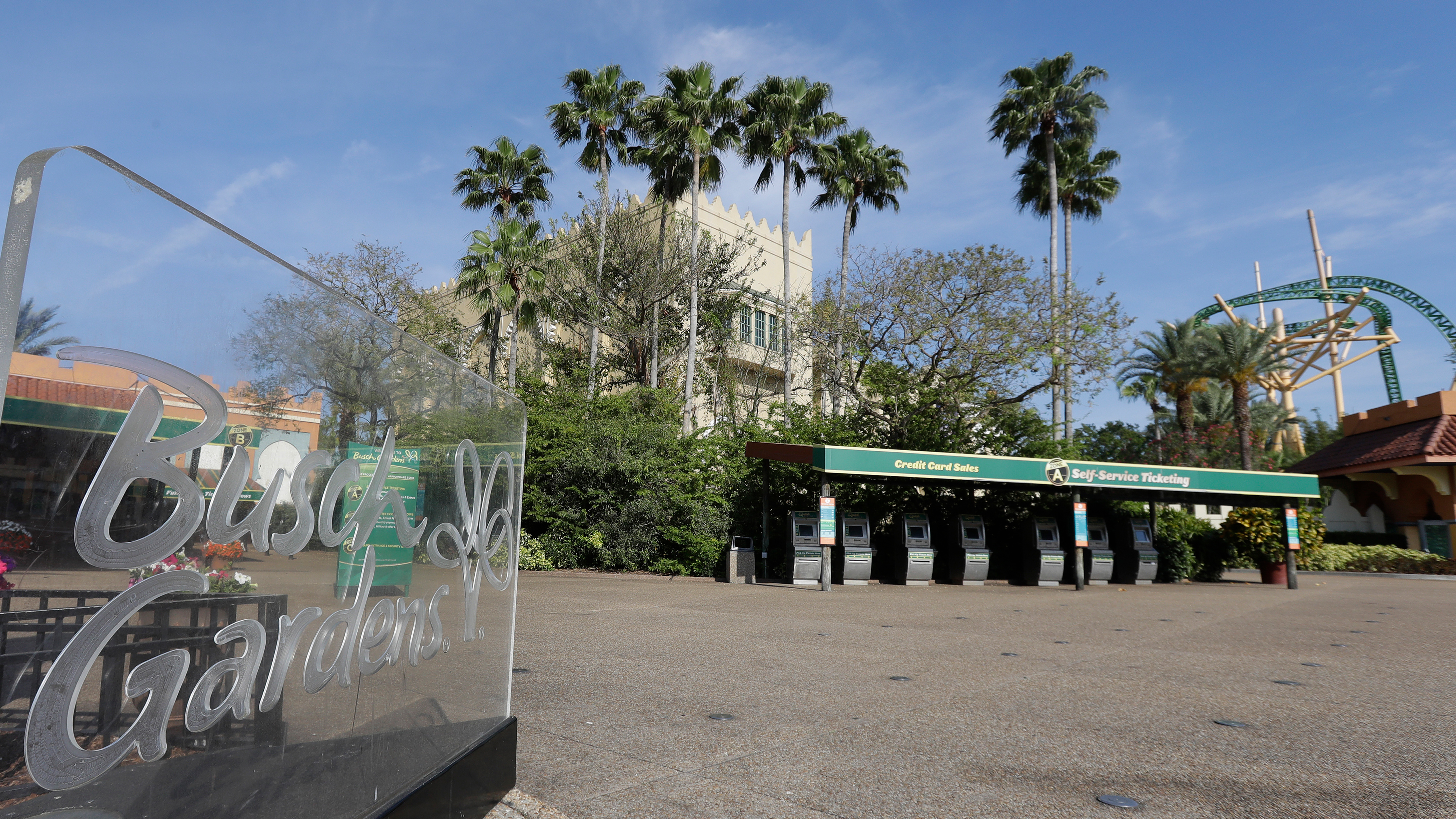 Ticket machines sit idle at Busch Gardens Tampa Bay Monday, March 16, 2020, in Tampa, Fla.