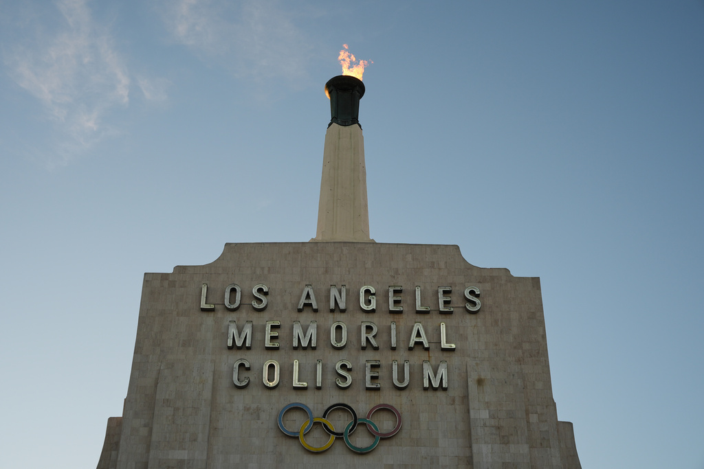The Olympic cauldron is lit at the Los Angeles Memorial Coliseum ahead of the launch for ticket registration to the 2028 Summer Olympic Games Tuesday, Jan. 13, 2026, in Los Angeles. 