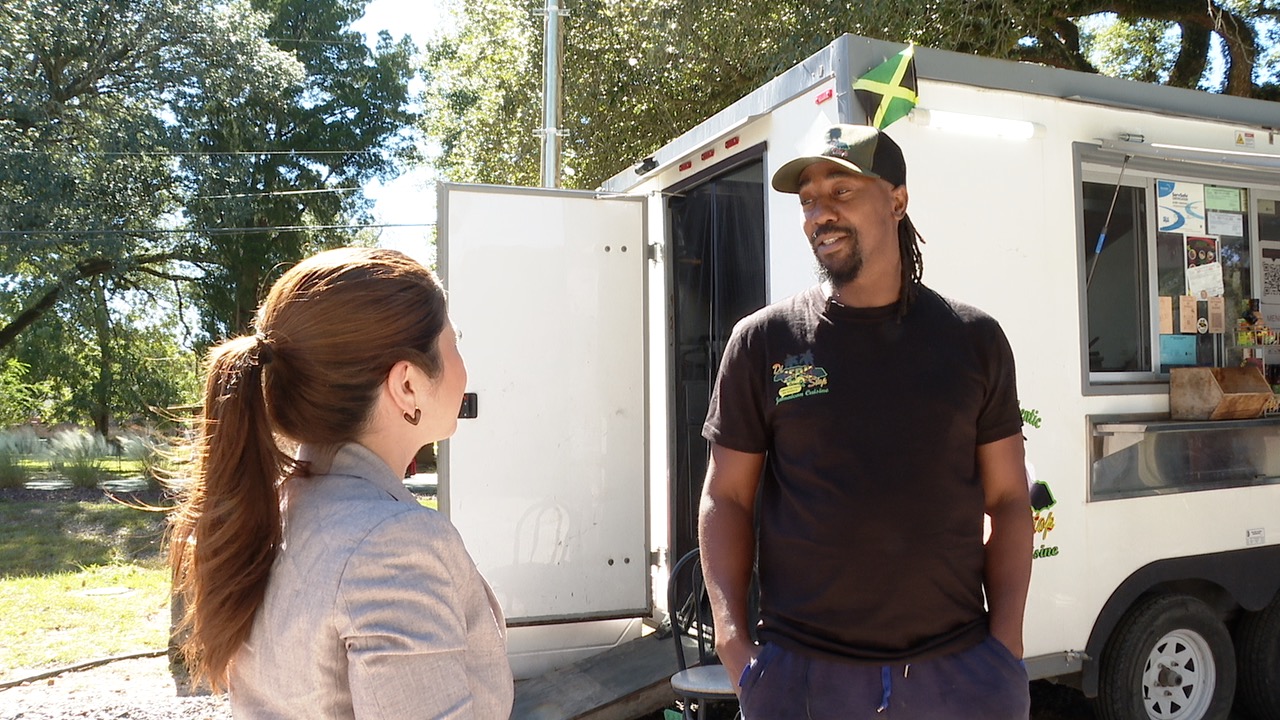 Owner of Di Jerk Stop with KATC reporter Christina Mondragon