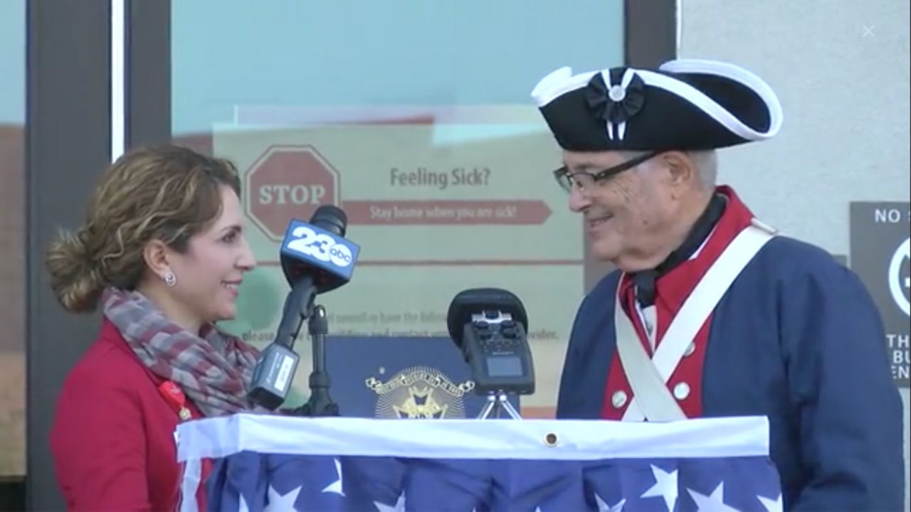 Kern S.A.R. Color guard gives flag certificate to Kern Family Health Care CEO Emily Durant