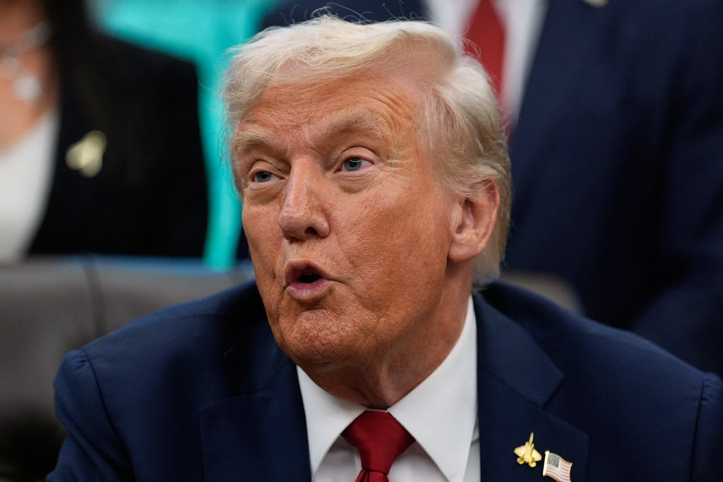 President Donald Trump speaks in the Oval Office of the White House before signing an executive order regarding childhood cancer and the use of AI, Tuesday, Sept. 30, 2025, in Washington. 