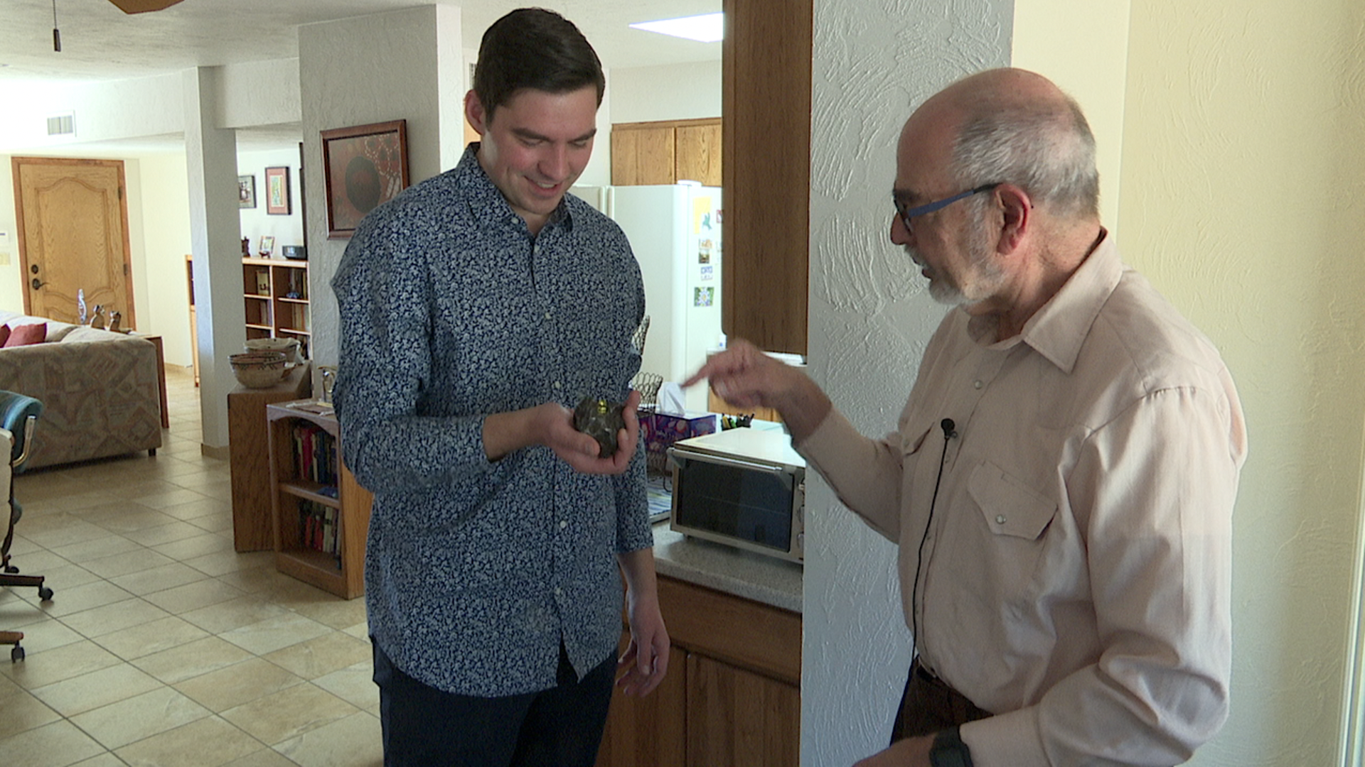Larry Lebofsky shares one of his educational kits, filled with rocks from Earth and outer space.