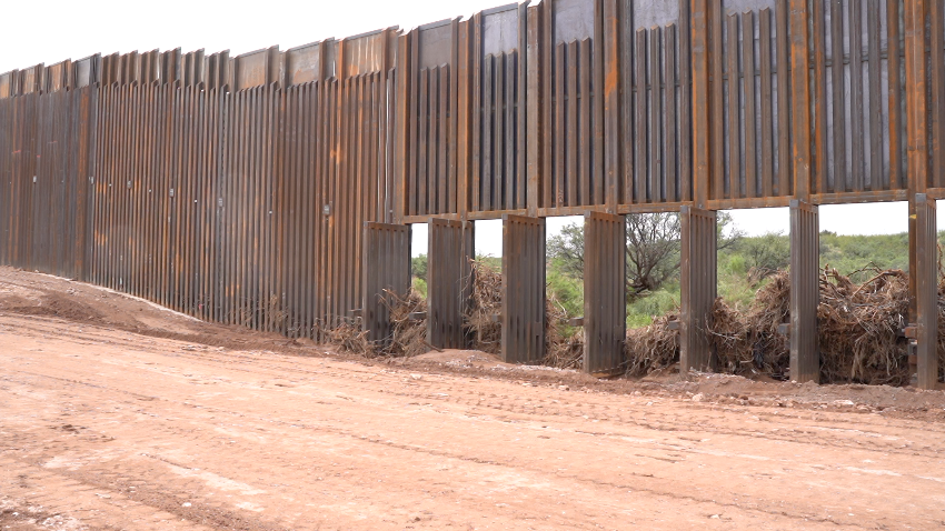 Flood gates with debris at southern border wall