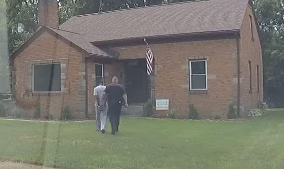 Realtor handcuffed.PNG