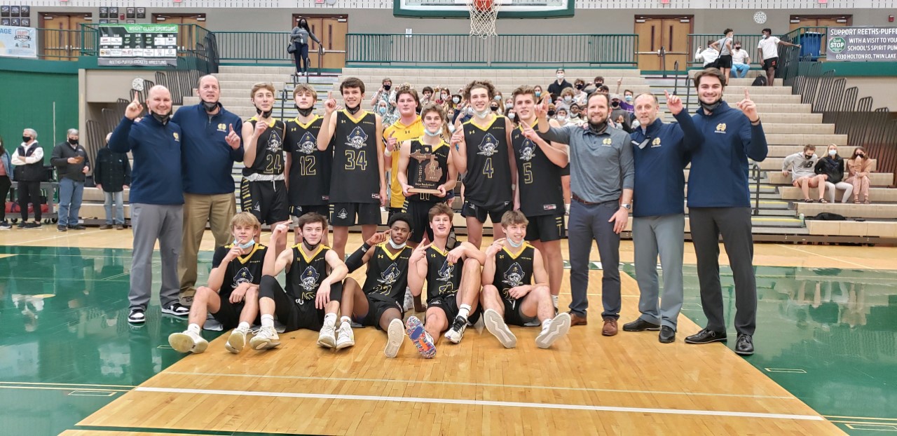 Grand Haven boys basketball wins district title