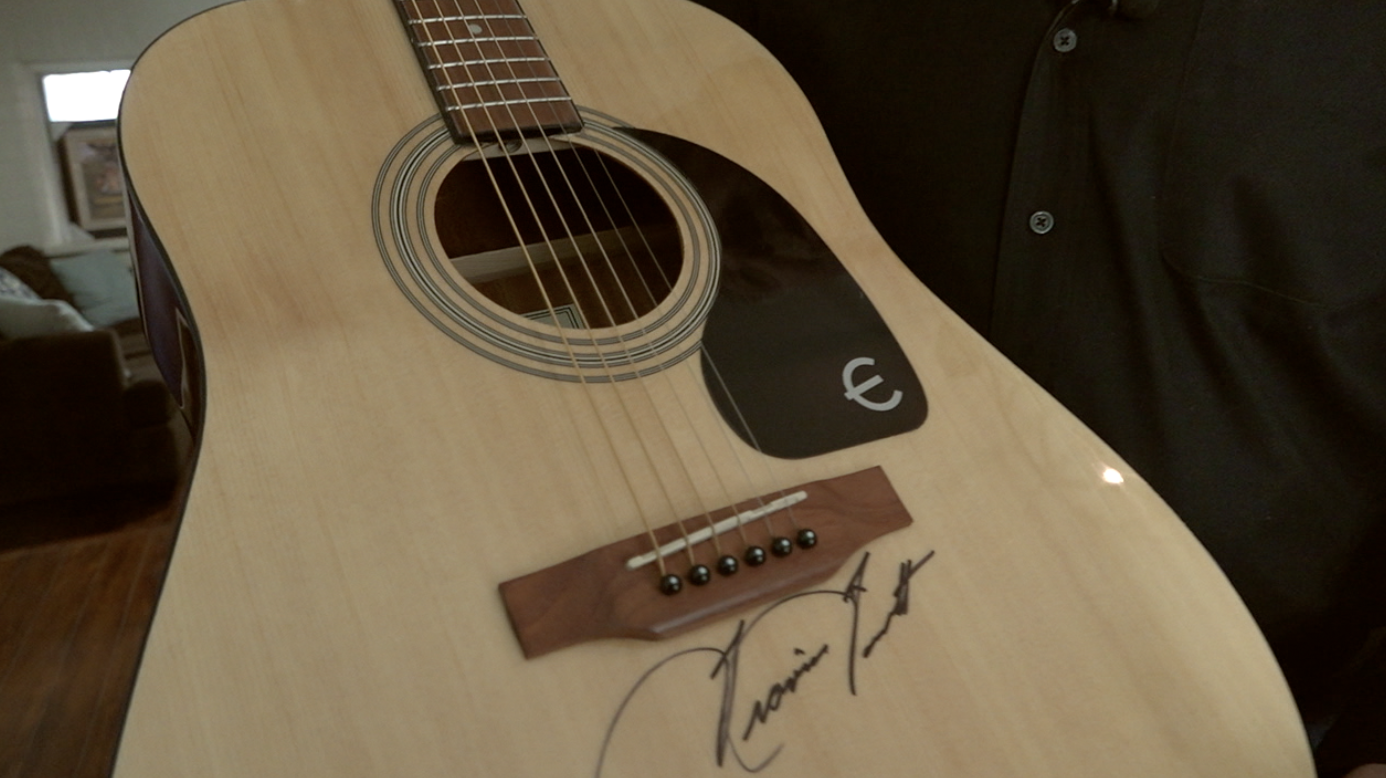 Autographed guitar.png