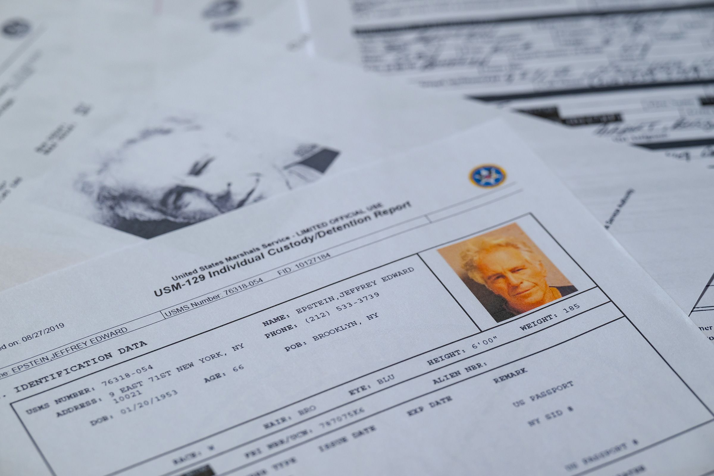 Printed copies of documents released by the U.S. Justice Department in connection with court cases involving the late financier and convicted sex offender Jeffrey Epstein, are seen in this photo illustration from February 8.