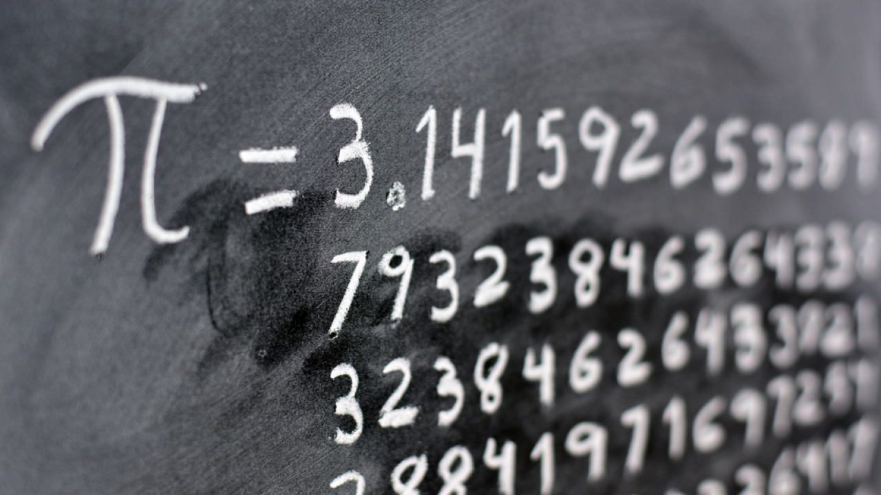 The ratio for pie written on a board goes on well beyond 3.14.