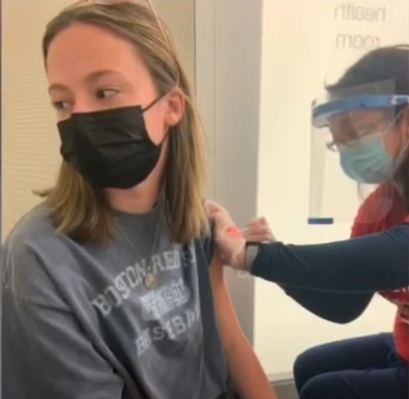 teen gets vaccine.jpg
