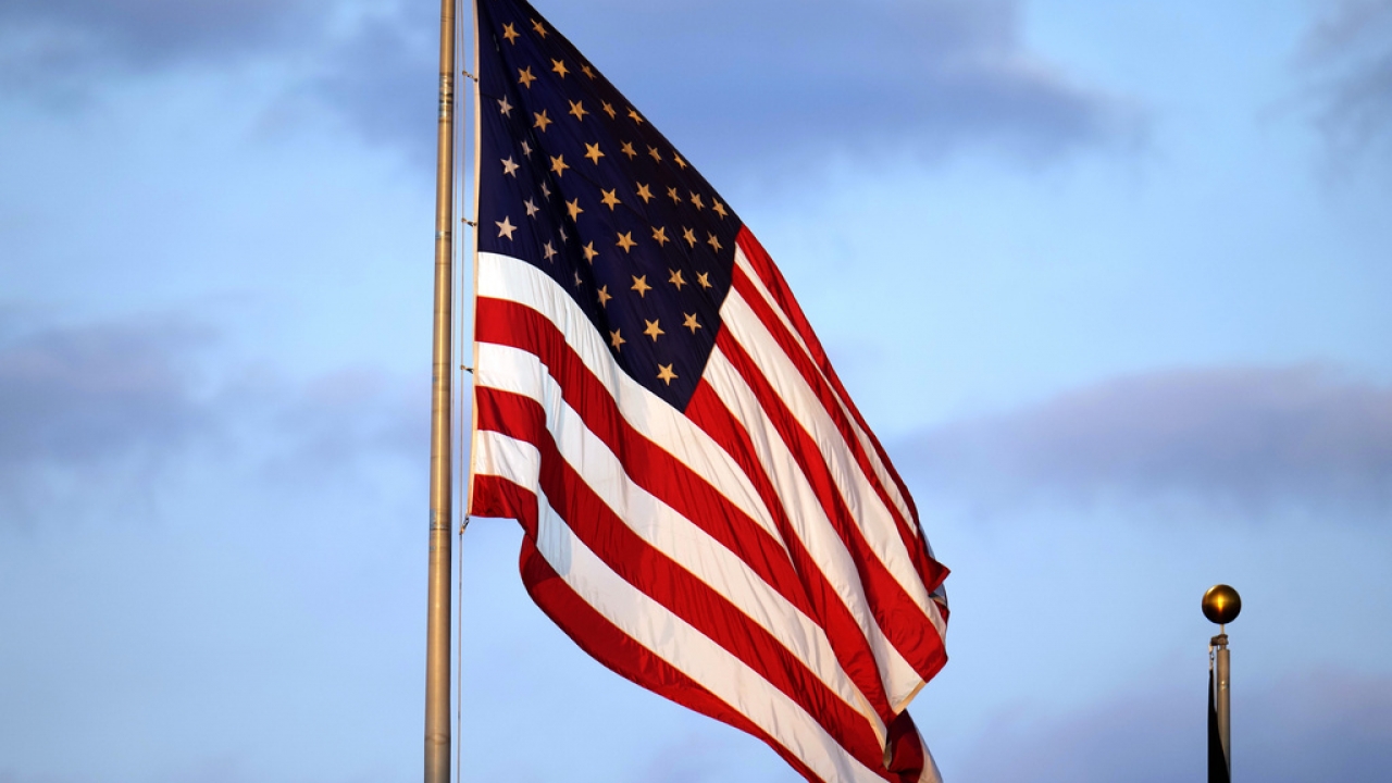 An American flag waves in the wind.