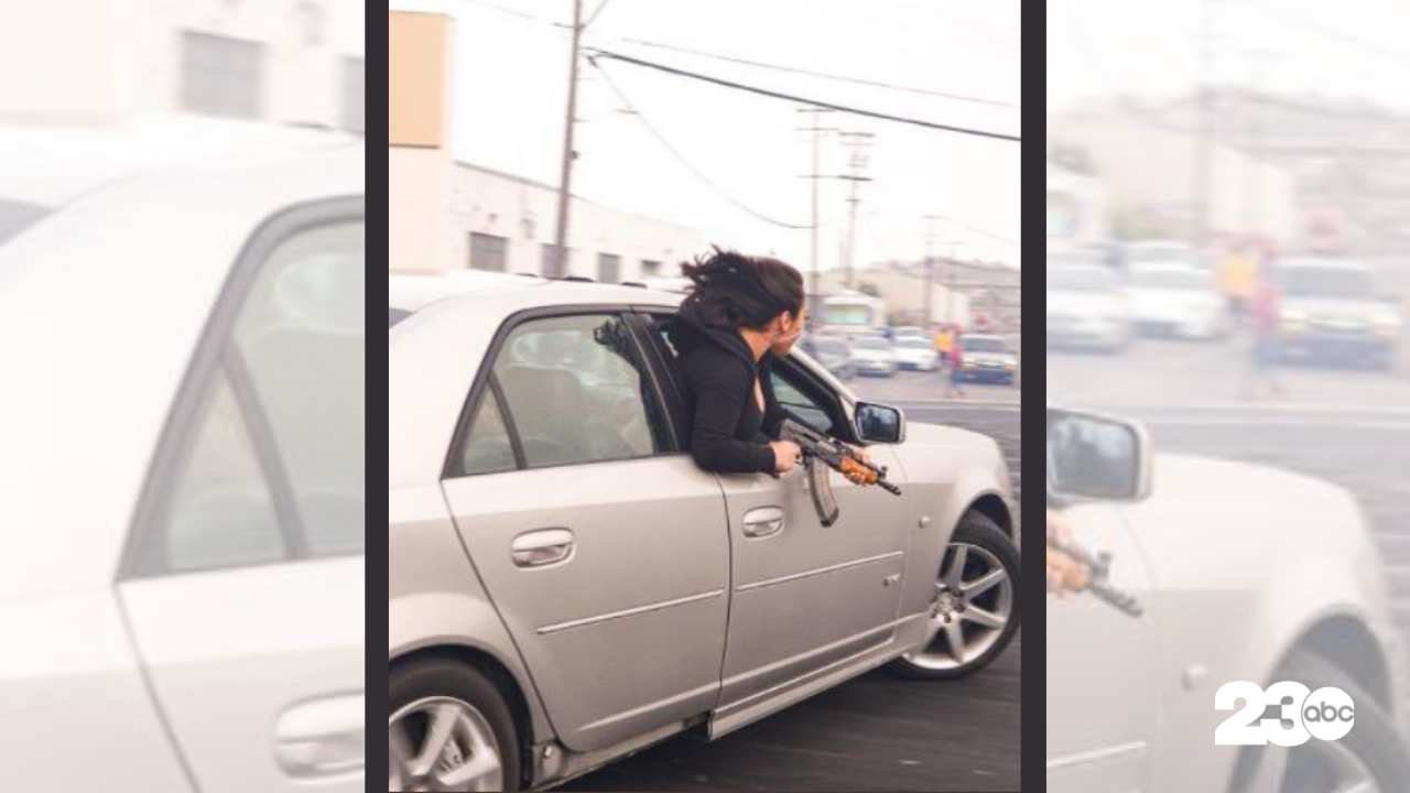 Woman Holding AK-47, San Francisco, July 11, 2021