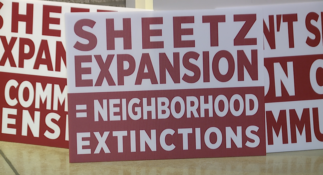 Signs at the Farmington Hills Planning Commission meeting