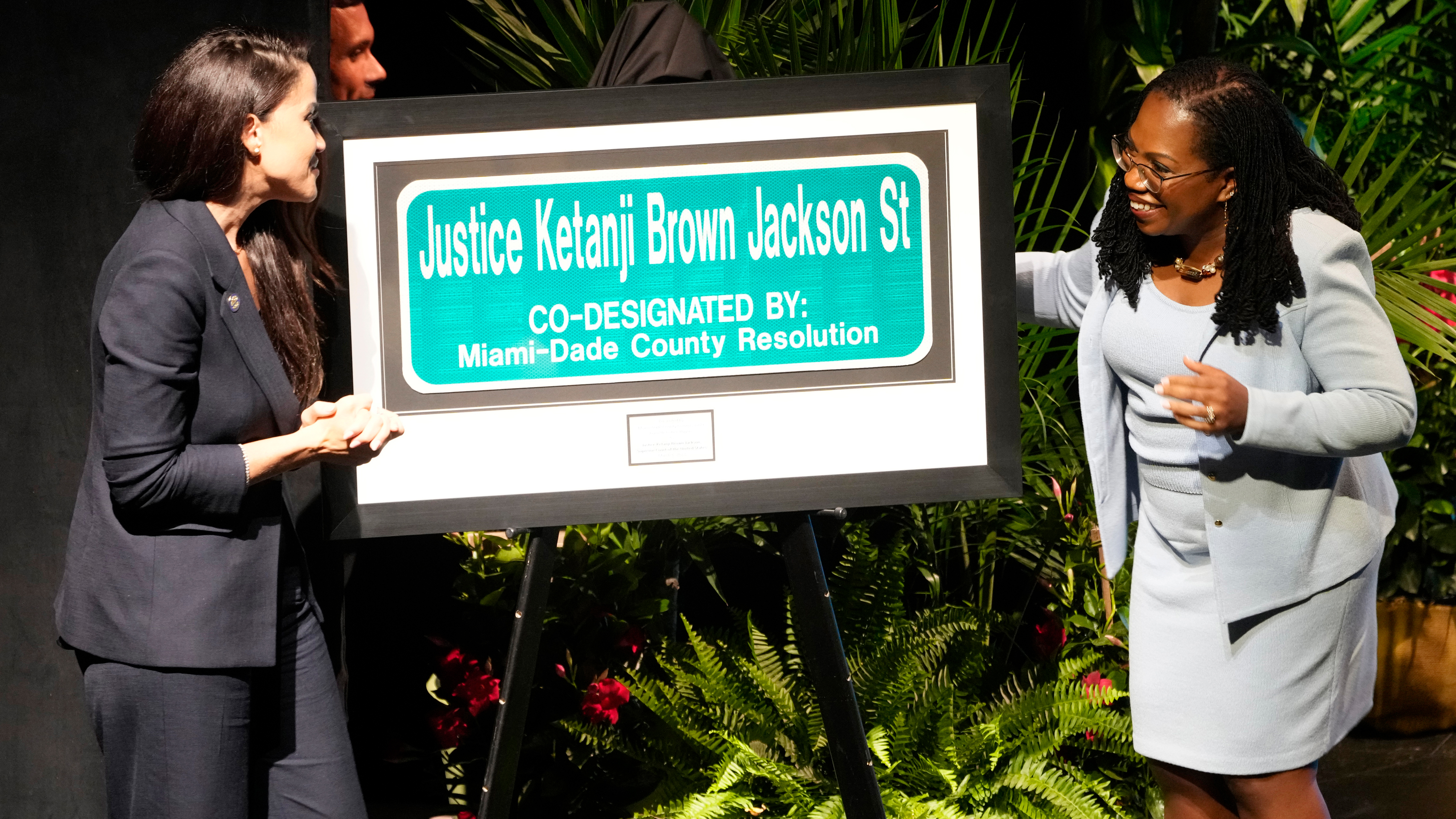 U.S. Supreme Court Justice Kentanji Brown Jackson looks at a street sign named in her honor, Monday, March 6, 2023, in Cutler Bay, Fla. To the left is Miami-Dade Commissioner Danielle Cohen Higgins who sponsored the event. 