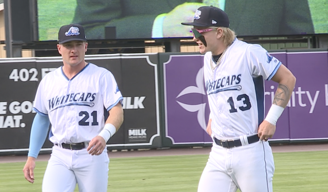 Kevin Mcgonigle and Max Clark warm up for their first game in west Michigan