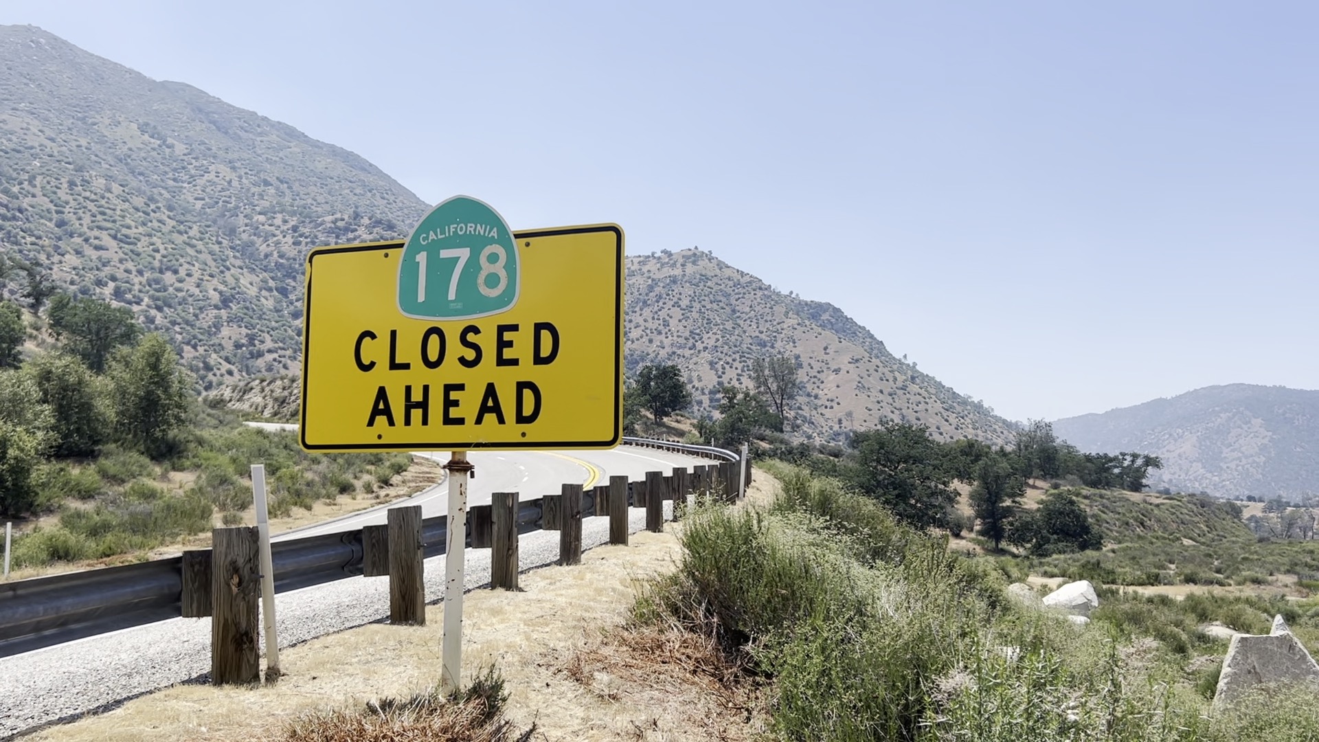 A road-side sign stating that Highway 178 is closed ahead. 