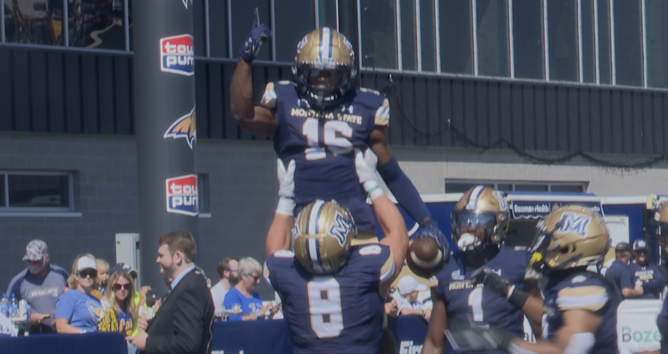 Derryk Snell lifts up Marqui Johnson.