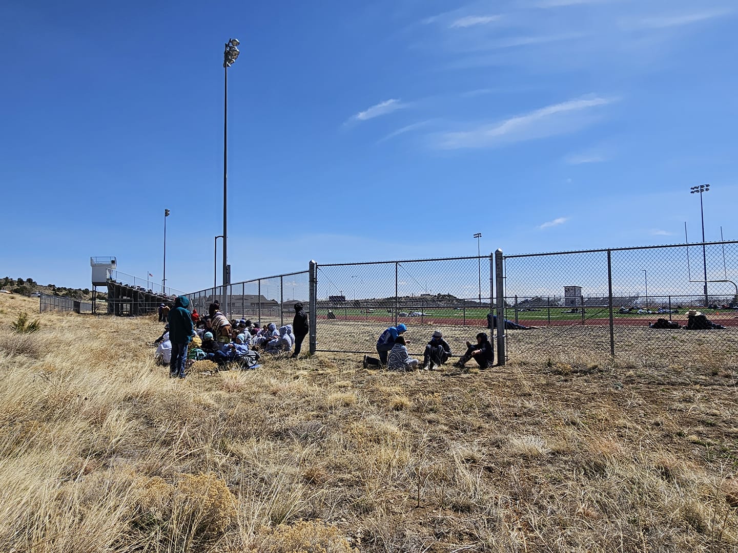 Students, staff, and attendees shelter